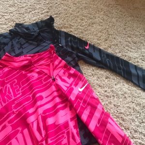 Two Nike Pro Girls small shirts